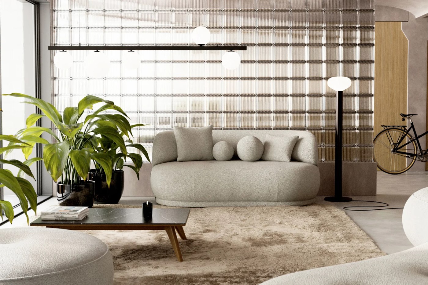Svetlá zaoblená pohovka BLAZE MINI SOFA A5 v interiéri pri sklobetónovej stene.