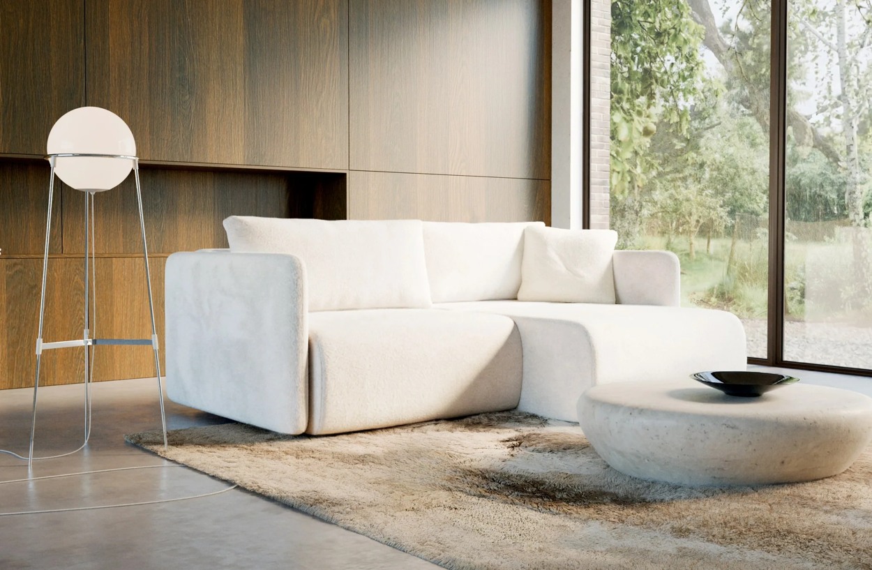 VANTIO sofa v interiéri s jednou rozloženou polovicou a druhou časťou ponechanou na sedenie.