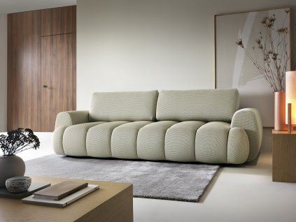 Rozkladacia pohovka MODIVO SOFA v interiéri pri stene, svetlozelené čalúnenie, pohľad v uhle spredu.