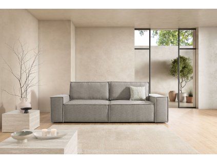 Sivá rozkladacia pohovka LEXUS sofa v obývačke, čelný pohľad s vankúšom.