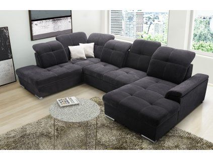 Účková sedacia súprava URBAN NEW XL v tmavosivom čalúnení v obývačke pri okne, pohľad spredu na veľký tvar do U.