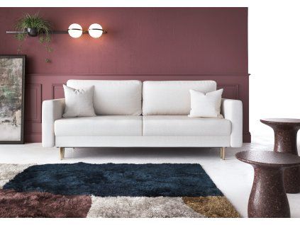 Rozkladacia pohovka COLD v prevedení sofa svetlá v interiéri pri stene, čelný pohľad na operadlo a vankúše.