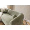 Rohová sedacia súprava SPACE R2 detail sedacej časti a operadla so zelenou tkanou látkou, guľatým vankúšom a plynule oblou bočnicou.