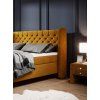Boxspring posteľ NOLAN - horčicová - pohľad zboku - v interiéri