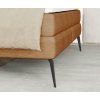Boxspring posteľ LENDO, detail čalúneného rohu rámu a tmavej kovovej nohy.