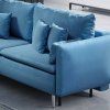 Rozkladacia pohovka CRUX v prevedení SOFA v modrej farbe, detail rohu s vankúšmi a štruktúrou poťahovej látky.