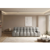 Rozkladacia sedacia súprava ZEN sofa svetlosivá, čelný záber v modernom interiéri so symetricky radenými prešívanými sedákmi.